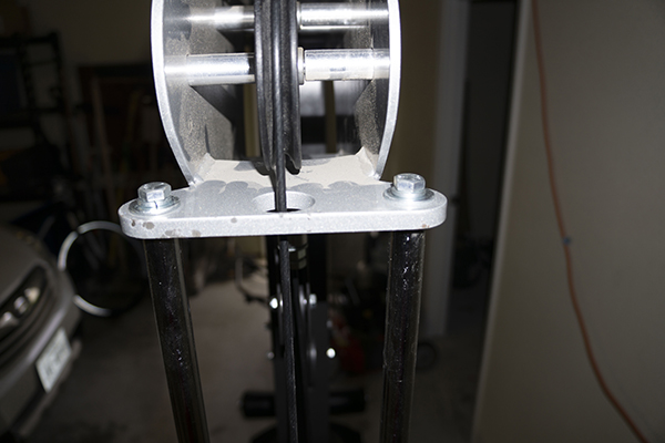 Photograph of Hoist Fitness V5 vertical gym showing plate guide rod top bolts.